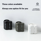 Three portable compact fans in black, dark green, and white colors on white surface